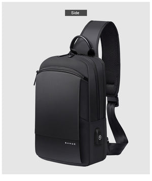 Black crossbody bag side profile with top handle, textured back panel, and shoulder strap.