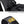 Black padded handle loop and shoulder strap with logo webbing and bus card pocket area.