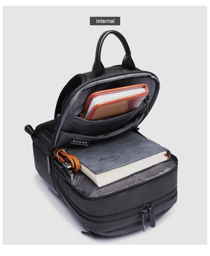 BANGE compact black waterproof crossbody bag opened, showing interior compartments