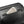 Black textured laptop backpack front zip pocket with elastic card slot