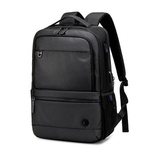 Black waterproof backpack with textured front panel, top handle, and side straps