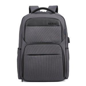 Grey large travel backpack with padded compartments, top handle, and side pockets