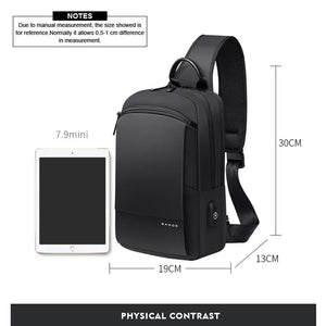 Black compact crossbody bag shown with tablet size for scale; adjustable shoulder strap.