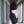 Compact waterproof crossbody bag in black, worn from back with shoulder strap