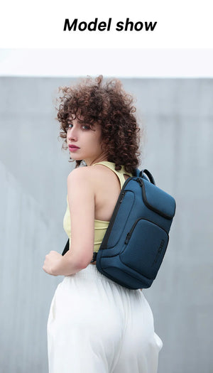 Compact waterproof crossbody bag, dark blue with top handle and side pocket