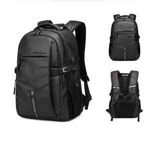 Black travel backpack with padded straps, front zip pocket, and side accessory straps