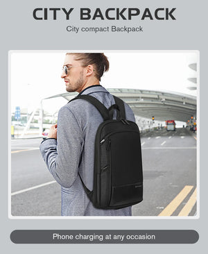 Person wearing expandable waterproof business backpack, black, side view with straps