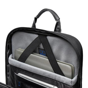 Black backpack interior close-up with padded laptop sleeve and divider strap
