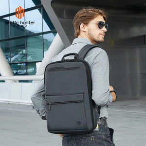 Black business backpack with front zip pocket and padded shoulder straps