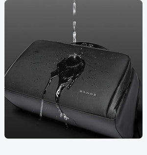 Black toiletry bag with water droplets on textured fabric and top zipper