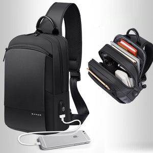 Black crossbody bag with interior pockets; includes charging cable and open storage view.