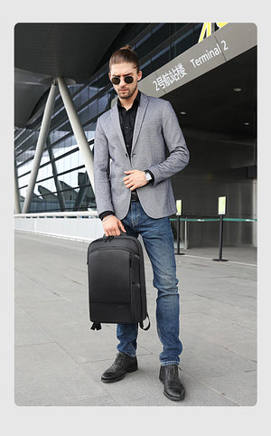 Black business backpack worn on the back with front pocket and adjustable shoulder strap