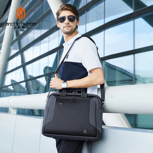 Protective waterproof laptop bag, black with shoulder strap and side zip pocket details