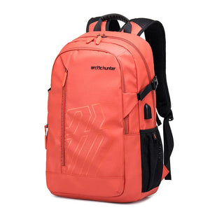 Orange waterproof travel backpack with front zipper pockets and padded shoulder straps