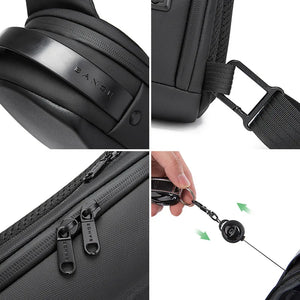 Black textured sling bag with BANGE logo, zipper pulls, and keychain clip