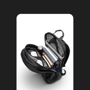 Black backpack open to show interior compartments and padded laptop sleeve
