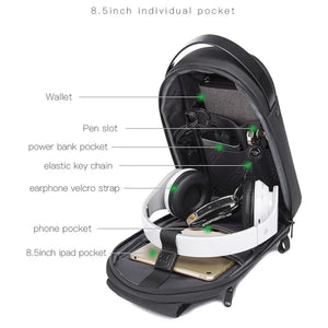 Black sling bag open interior with multiple pockets and elastic key strap