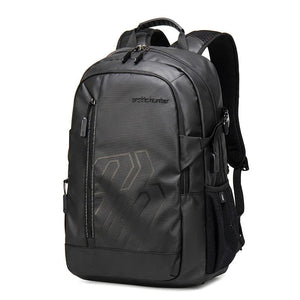 Black waterproof travel backpack with front logo, zip pockets, and padded shoulder straps
