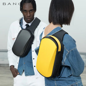 Black crossbody sling bag worn on model with adjustable strap and front zipper pocket