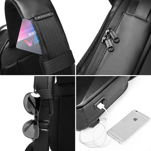 Black crossbody bag close-up with zipper pulls and charging cable connected