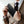 Black leather long wallet held in hand, slim profile with front logo