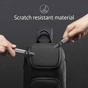 Black crossbody bag with flap top and scratch-resistant textured exterior