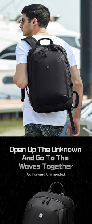 Black waterproof travel backpack with front zip pockets and top grab handle
