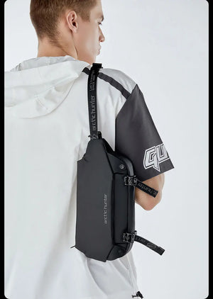 Black compact crossbody bag with adjustable strap and front flap pocket