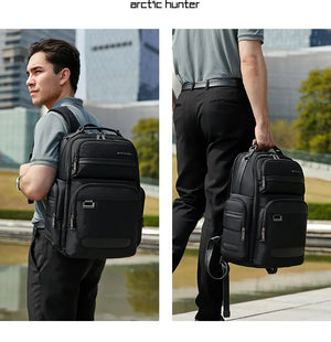Black waterproof travel backpack, front and side view with adjustable shoulder strap