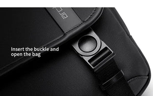 Black bag buckle mechanism close-up with insert point and strap holder