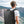 Black high-capacity backpack on a person’s back with dual front compartments.