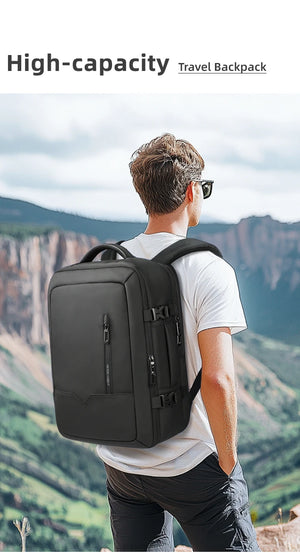 Black high-capacity backpack on a person’s back with dual front compartments.