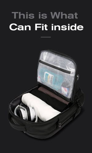 Black backpack open compartment with zip pouch organizer and gadgets inside
