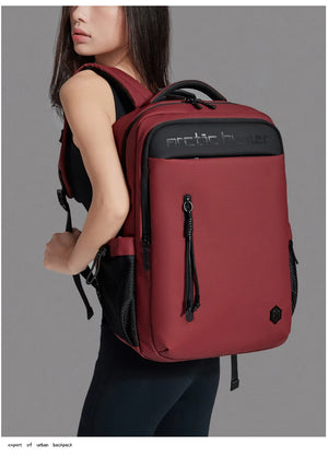 Red waterproof travel backpack with front zip pocket and adjustable shoulder straps