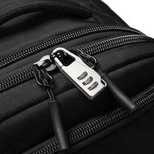 Black zipper track detail with metal pull tab on travel backpack