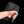 Black waterproof tech storage bag zipper closeup with hand pulling the tab