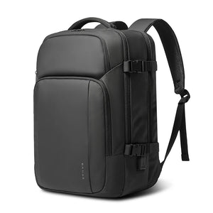 Black waterproof travel backpack with front pocket, buckle straps, and top handle.