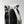 Grey roll-top waterproof travel backpack with side pocket and black straps