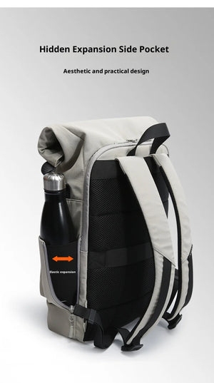 Grey roll-top waterproof travel backpack with side pocket and black straps