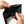Black leather card holder wallet opening to show card slots and fold pocket.