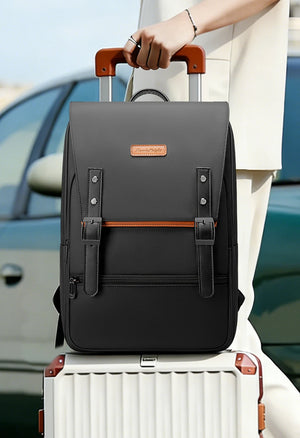 Black commuter backpack with orange accent logo and top handle