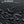 Close-up of black Oxford waterproof fabric texture on a crossbody messenger bag