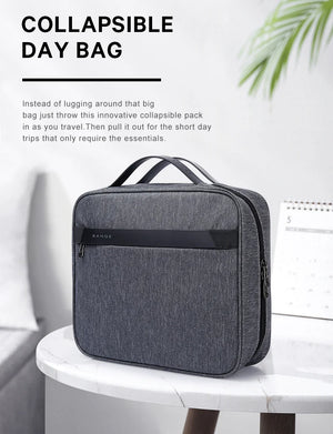 Gray collapsible waterproof toiletries bag with carry handle and front zip closure