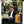 Yellow and black compact waterproof backpack on bench with USB charging port