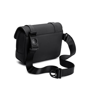 Black compact cross-body bag with flap front and adjustable shoulder strap