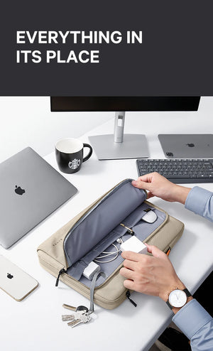 Beige laptop bag open with compartments for devices and accessories