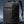 Black waterproof travel backpack with curved front panel, buckle strap, and top carry handle.