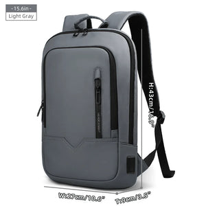 Light gray compact waterproof backpack with front pocket, side strap, and USB port panel