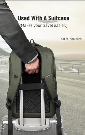 Green travel backpack with suitcase strap for easy airport carry