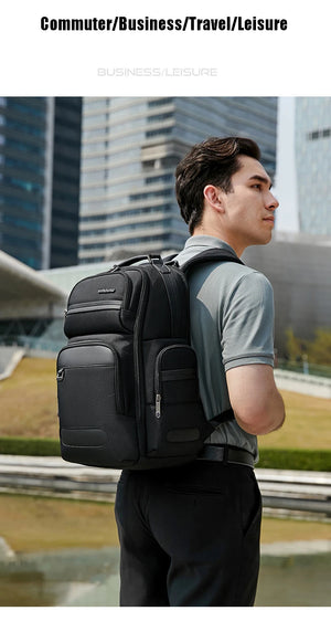 Black waterproof travel backpack with multiple front pockets and padded shoulder straps